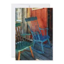 Blue Chair Against Red Door