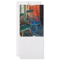 Blue Chair Against Red Door