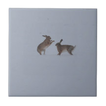 Boxing hares ceramic tile