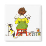 Boy reading magnets