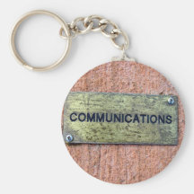 Brass plate on concrete wall key chains