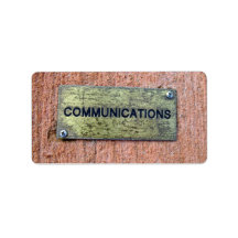 Brass plate on concrete wall labels