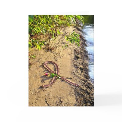 Breast Cancer Greeting Card-Pink ribbon in sand. by ByTheBecks