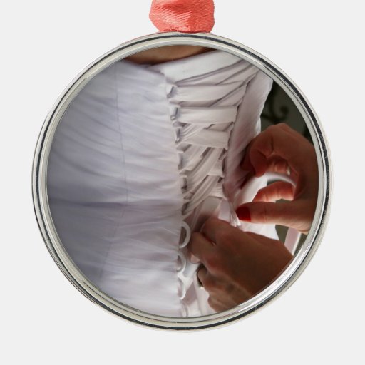 Bridesmaid hand lacing wedding dress photograph ornament