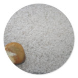 Brown and white round rock on cream carpet sticker