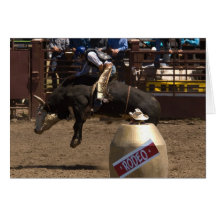 Bull rider hangs on for dear life card