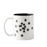 Bullet holes from a rifle or gun, possibly shotgun coffee mugs
