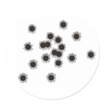 Bullet holes from a rifle or gun, possibly shotgun round sticker