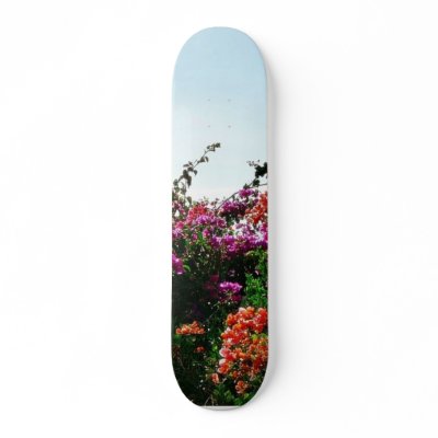 Bush With Purple Red And Orange Flowers Skateboard Deck by lifesphere