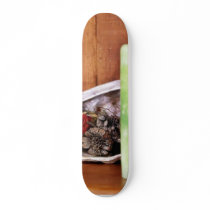 Candle On A Shelf With Some Pinecones And Stuff In Skate Board Decks
