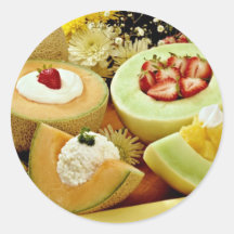 Cantaloupes and melons on cutting board with flowe round stickers