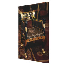 Carved armchair with gilt details stretched canvas print