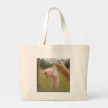 Cat in a cacoon tote bags
