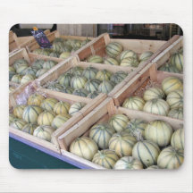 Charentais melons displayed in grocery store mouse pads