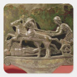 Charioteer in his chariot, detail from a cist stickers