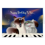 Chats jouant le piano carte
