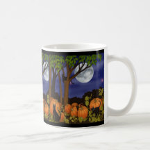 Chats noirs et tasse de citrouilles