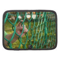 Child finger on fence planners