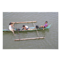 Children playing in a fishing boat photo print