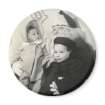 Children sitting on Santa's lap circle magnet