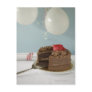 Chocolate cake with missing slice on table, postcards