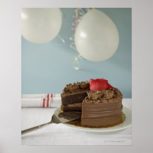 Chocolate cake with missing slice on table, print