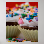 Chocolate cupcakes with icing and sprinkles, posters