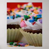 Chocolate cupcakes with icing and sprinkles, posters