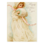 Christmas card depicting a girl with a muff postcard