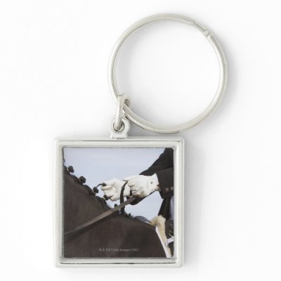 close-up of dressage horse with rider keychains by prophoto