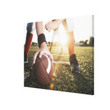 Close up of football centre preparing to snap canvas print