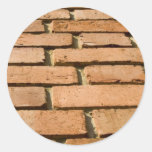 Closeup of a brick wall round stickers