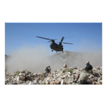 Clouds of dust kicked up by the rotor wash