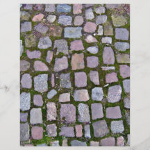 Cobblestone Pavement With Moss Growing Between Sto Flyers