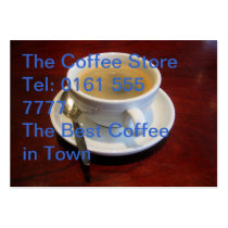 Coffee cup on wooden table business cards