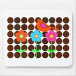 colourful bird with flowers and polka dot backgrou mousepads