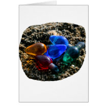 Colourful Christmas Bulbs in Beach Sand Photograph