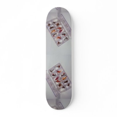 Colourful fishing hooks kept in fly box skate deck by inspirelove