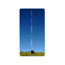 Communication tower against blue sky address label
