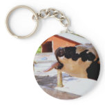 Cow sticking it's tongue out for popcorn keychain
