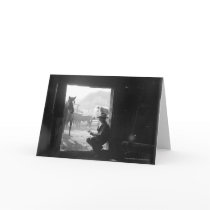 Cowboy in a doorway with horses cards
