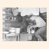 Cowboy making coffee inside the bunkhouse postcards