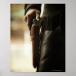 Cowboy with gun in holster posters