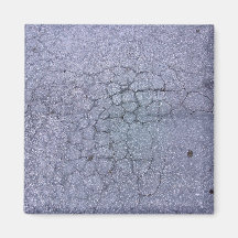 Cracks in asphalt pavement of walkway magnets