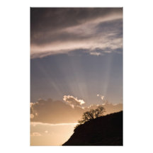 Crepuscular rays radiate across the sky at photo art