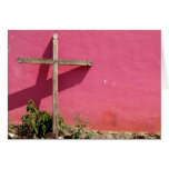 cross leaning on pink wall greeting card