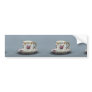 Cup and saucer with colorful flowers on it. bumper stickers