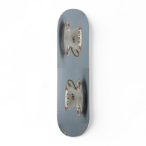 Cup and saucer with colourful flowers on it. skate boards