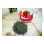Cup of black tea with chocolate biscuits greeting card