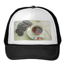 Cup of tea with chocolate mesh hat